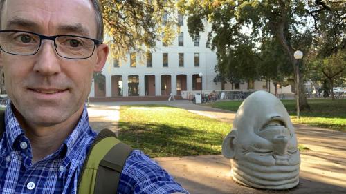 Marcel Holyoak and egghead statue